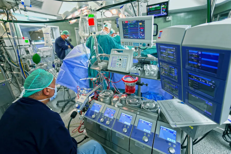 Perfusionist operating the heart-lung machine